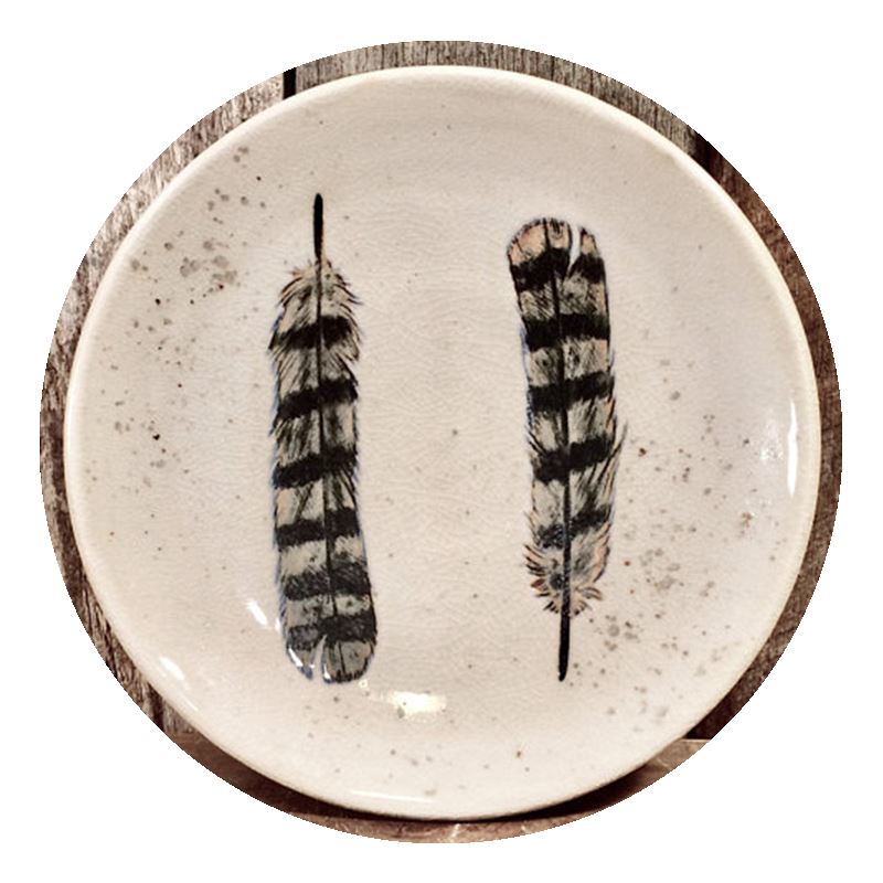 Plate illustrated with feathers by Burdock Ceramics