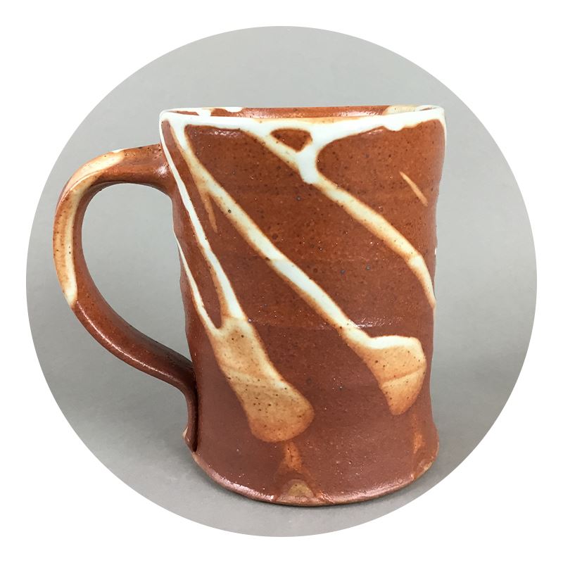 Copper-brown mug with light splashed glaze patterns by Craig Bruce
